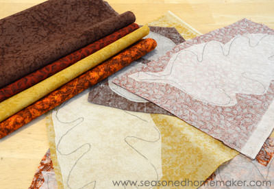 picking fabric to use for making leaves on a DIY Thanksgiving table runner